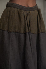 BACK PLEATS ASYMMETRIC SKIRT